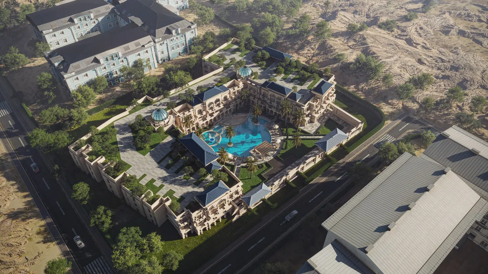 Aurora Palace aerial view showing the full resort-style residence, landscaped courtyard, pool, and surrounding roads