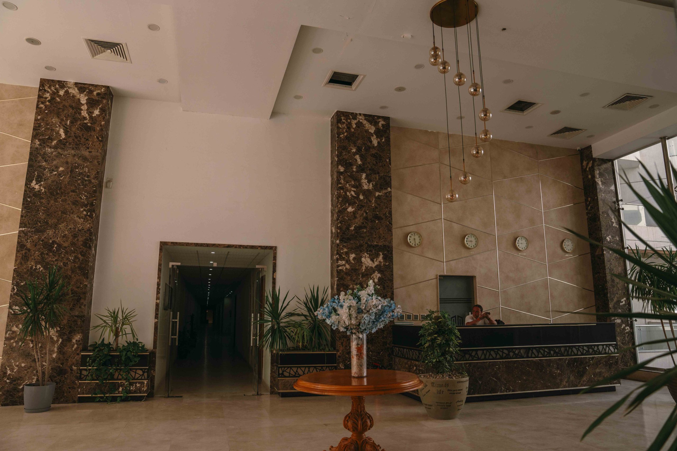 Staff member behind the reception desk in the Scandic Resort lobby, Hurghada