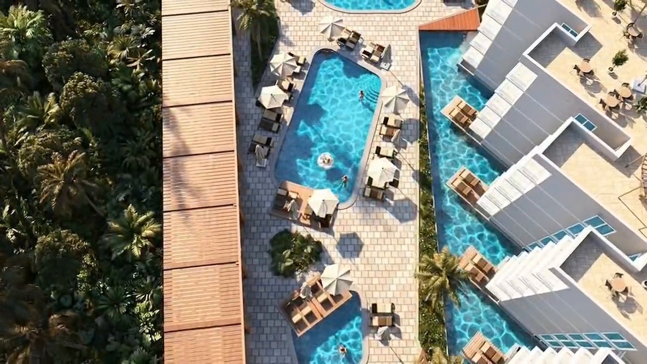 Aerial visualization of Sea Breeze Resort pools and buildings