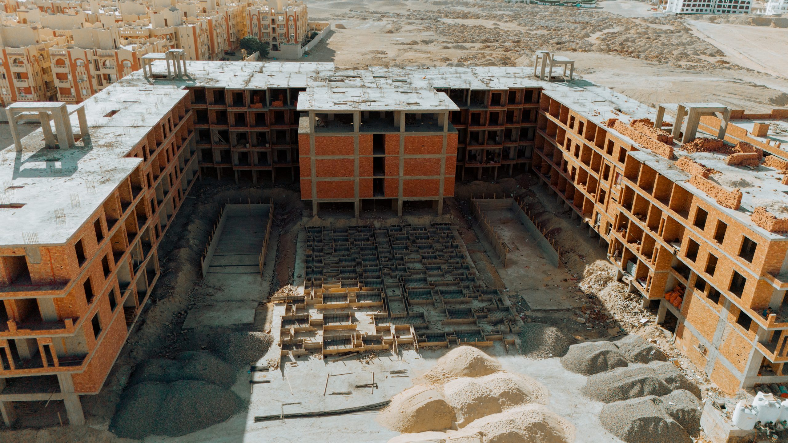 AQUA ORGWAN Resort — aerial construction view 9, July 2026