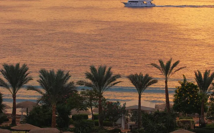 Swimming pool and Red Sea waterfront at sunset in Hurghada