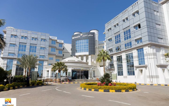 Exterior of Nile Hospital in Hurghada with entrance driveway and hospital signage