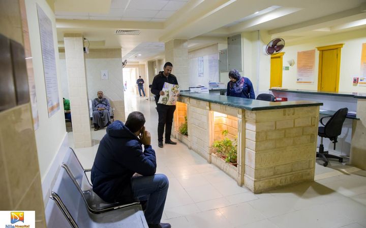Reception counter, staff and waiting seating at Nile Hospital in Hurghada